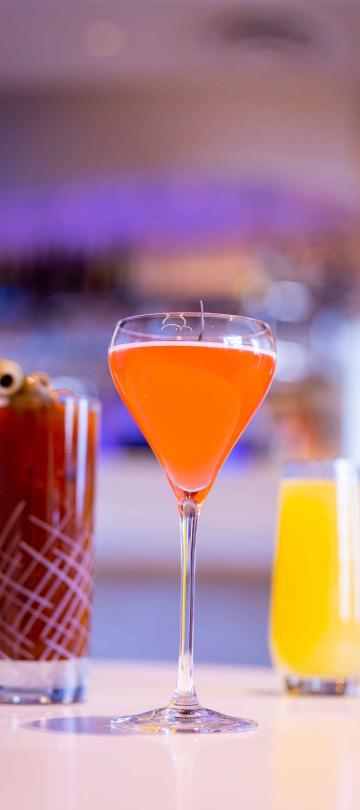 Three cocktails at the bar