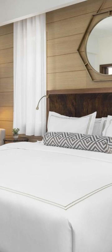 A king bed and balcony in a suite at Viceroy Kopaonik Serbia