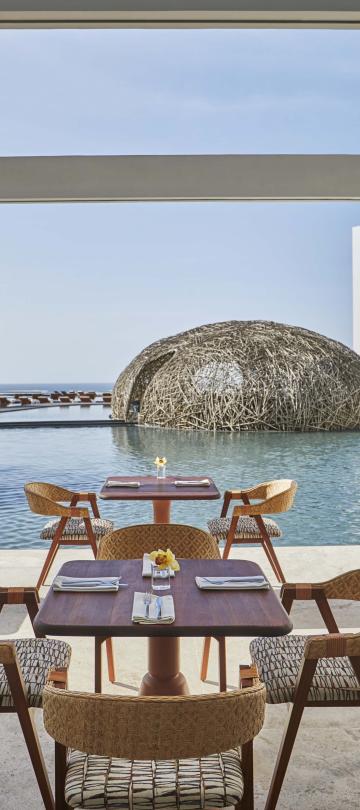 The outdoor patio overlooking a pool at Casero
