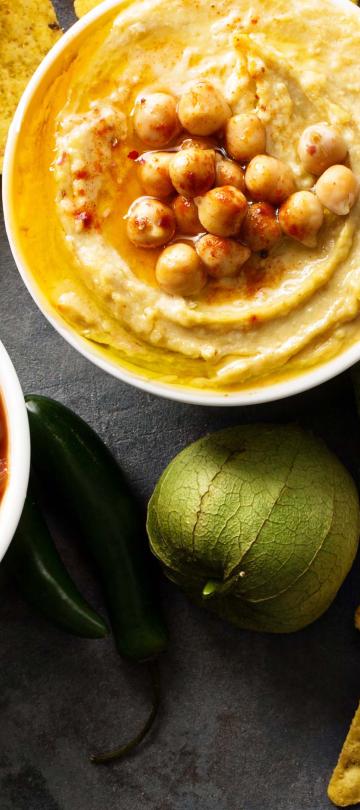 A spread of dips such as hummus & Guacamole at Viceroy Los Cabos