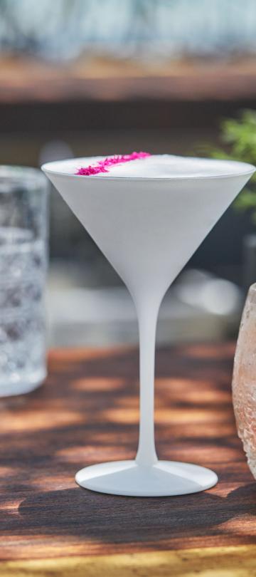 Two cocktails sitting on the bar at Nido