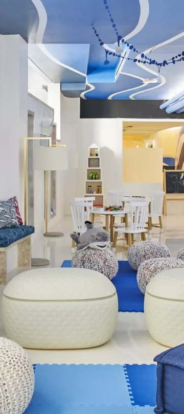 A kids play area with coloring tables and relaxing areas at Viceroy Los Cabos