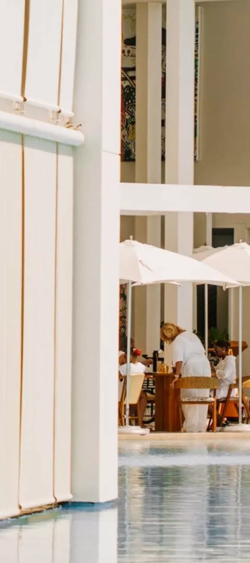 View of the patios with people dining at Viceroy Los Cabos