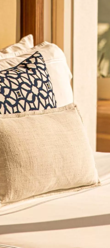 3 pillows on a bed in a suite at Viceroy Los Cabos