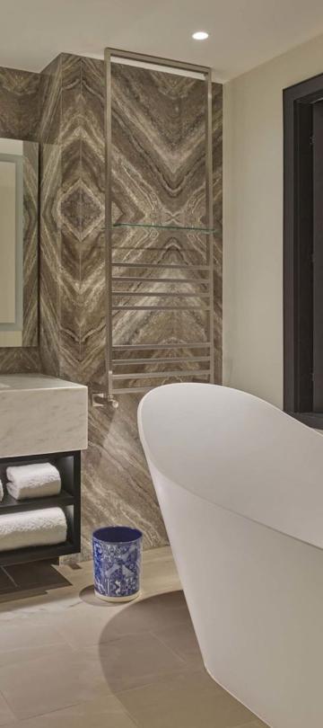 A soaker tub and vanity in a deluxe king room at Viceroy Ombria Algarve