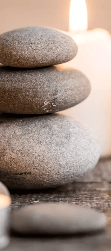 Stones and lit candles at Ombria Algarve