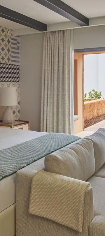 A warm bedroom with pool patio in two bedroom residence at Viceroy Ombria Algarve