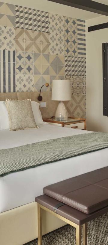A warm bedroom with large bed in a two bedroom residence at Viceroy Ombria Algarve