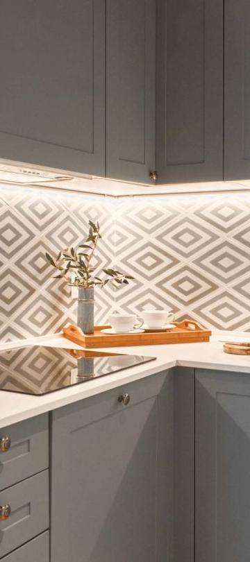 A kitchen with oven, sink and spacious countertop in a two bedroom residence at Viceroy Ombria Algarve