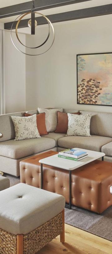An open living room with valley view in a two bedroom residence at Viceroy Ombris Algarve