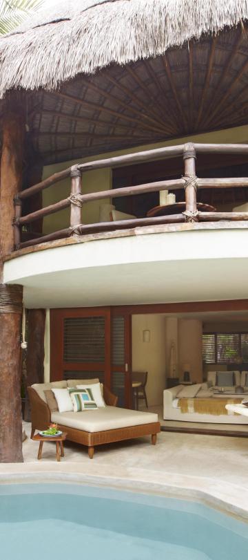 Exterior of a room at Riviera Maya with a private pool and lounge area