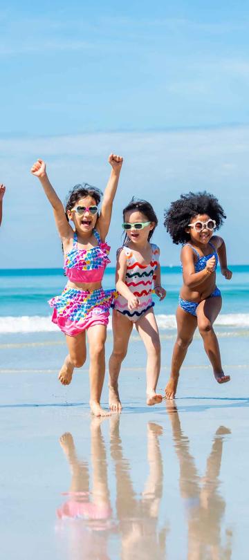Children running on the Santa Monica beach