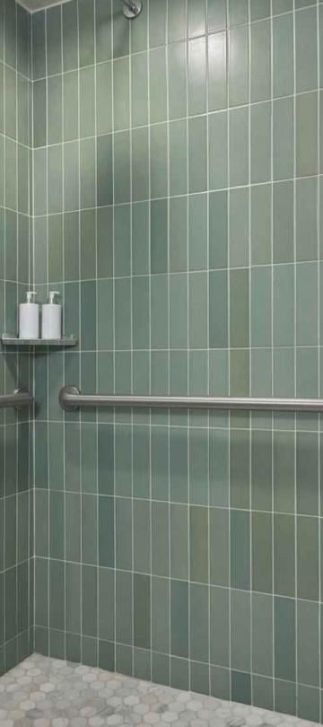 A green tiled shower in a suite at Viceroy Santa Monica