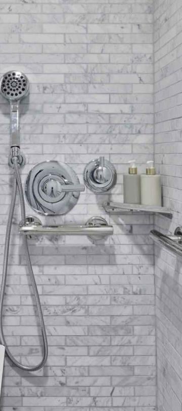A shower head in side the shower of a room  in a room at Viceroy Santa Monica