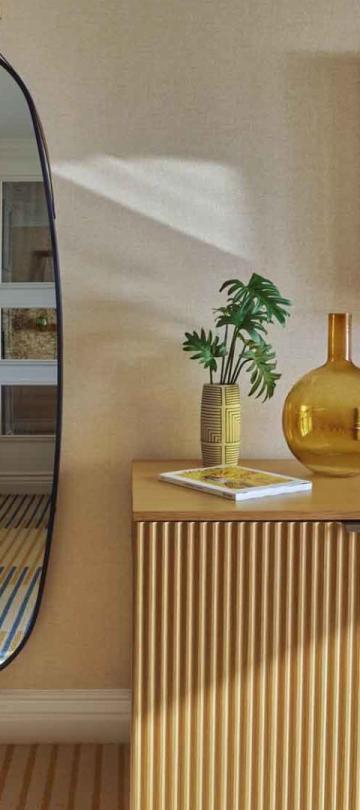 A credenza and wall mirror in a city view king room at Viceroy Santa Monica