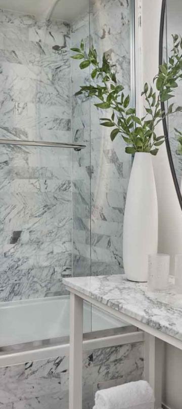 A marble counter top ina bathroom in a city view king room at Viceroy Santa Monica