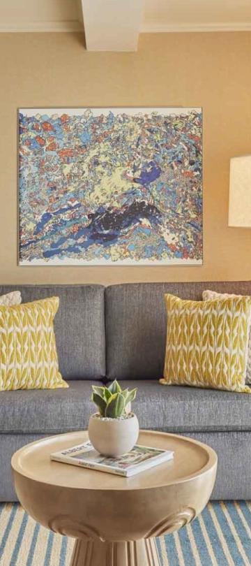 A couch and coffee table in a junior suite at Viceroy Santa Monica