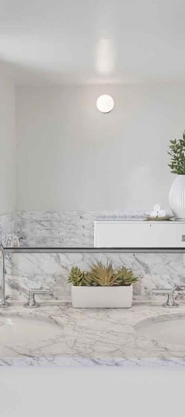 A one sink vanity with large mirror in a Junior Suite at Viceroy Santa Monica