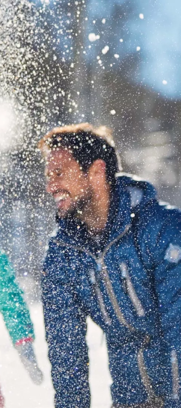 A family playing in the snow at Viceroy Serbia