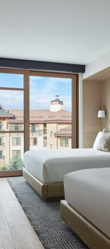 Two queen beds in a Snowmass guestroom