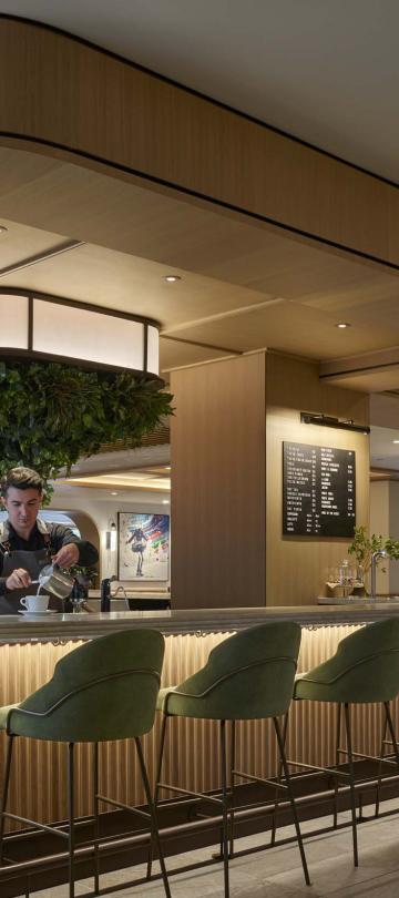 A barista prepares a latte at Café V at Viceroy Snowmass.