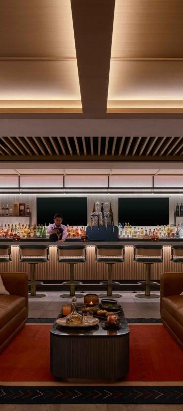 A bartender prepares a cocktail in the Viceroy Lounge at Viceroy Snowmass.