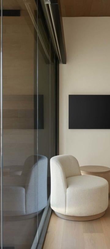 Two modern lounge chairs in the room of a Cirque Two Bedroom Penthouse Loft at Viceroy Snowmass