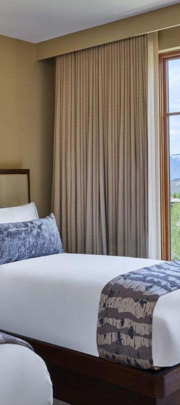 Two twin beds in a Mobility Accessible Pinnacle Two Bedroom, Roll-in Shower & Transfer Shower room at Viceroy Snowmass