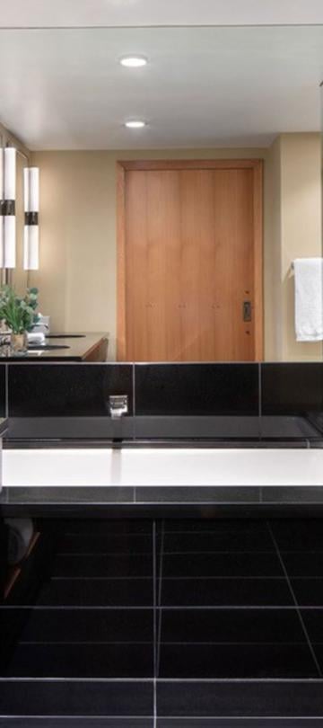 A large two sink vanity, shower and separate soaker tub in a pinnacle two bedroom residence at Viceroy Snowmass