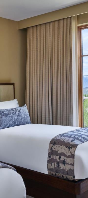 A room with two twin beds in a pinnacle two bedroom residence at Viceroy Snowmass