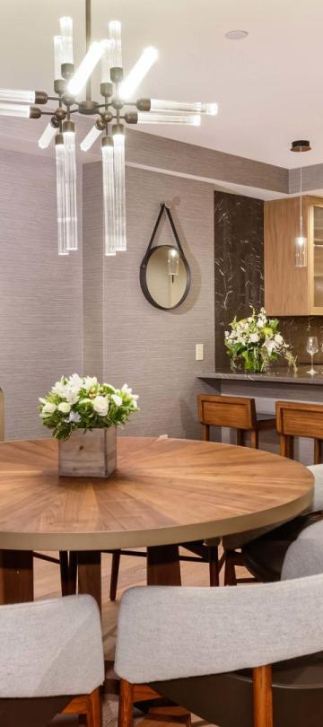 A six person round table and a large kitchen space in a Pinnacle Three Bedroom Penthouse at Viceroy Snowmass