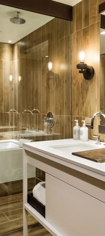 A two vanity washroom with a tub in a Pinnacle Three Bedroom Penthouse at Viceroy Snowmass