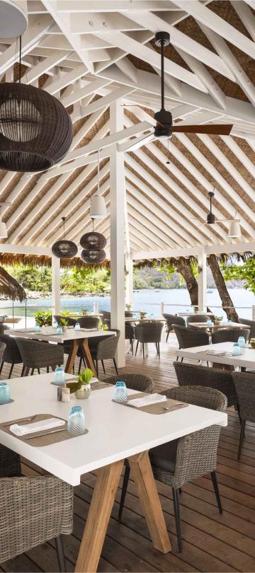 The outdoor restaurant Jalousie Grill, under a vaulted wooden roof
