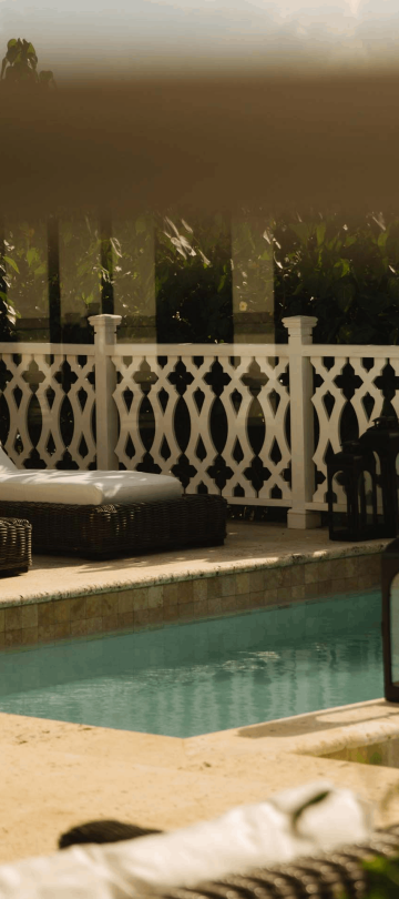Two lounge recliners by the pool at Viceroy Sugar Beach
