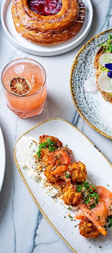 Aerial view of gourmet dishes and cocktails at Dovetail