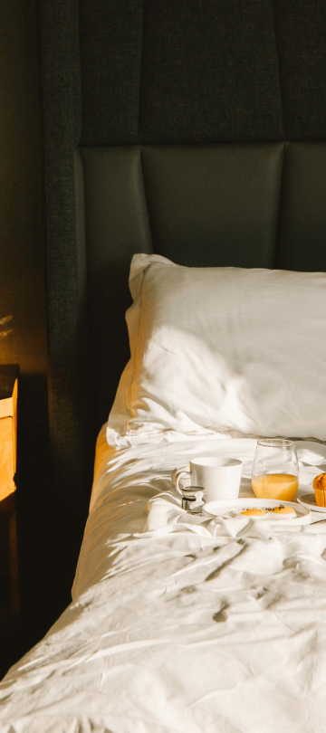 Breakfast on a bed in a room at Viceroy Washington DC