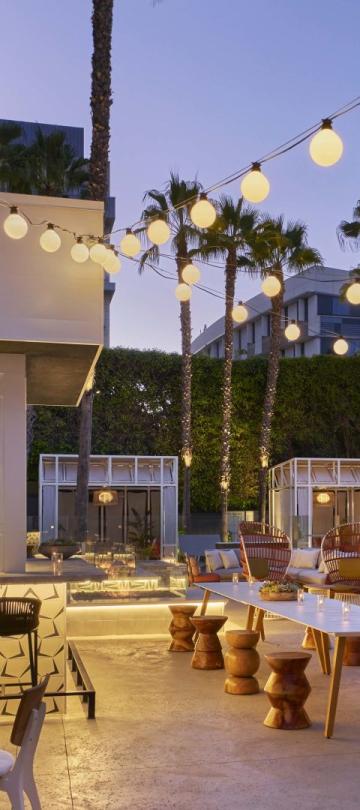 The Palm Bar patio at night at Sugar Beach