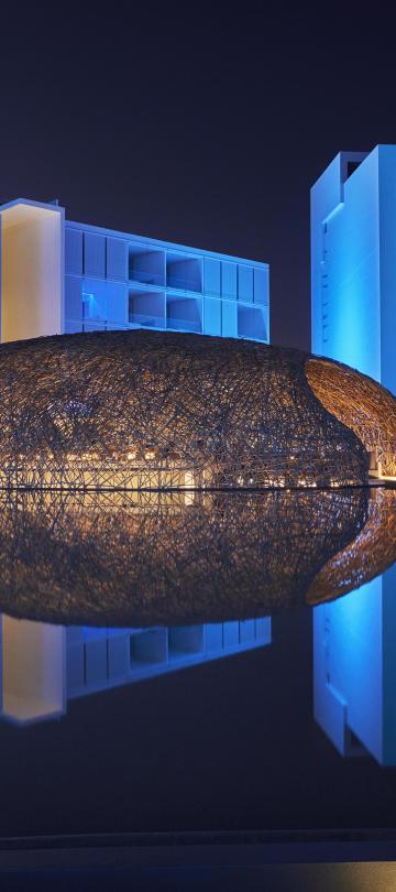 A nest-like dome over the restaurant Nido, built on a man-made pond at Viceroy Los Cabos