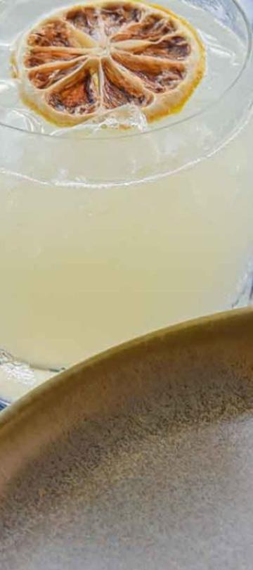 Tacos and a margarita on a Coral Grill + Bar table