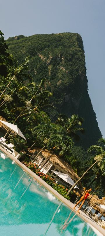 A beautiful beach surrounded by lush green mountains.