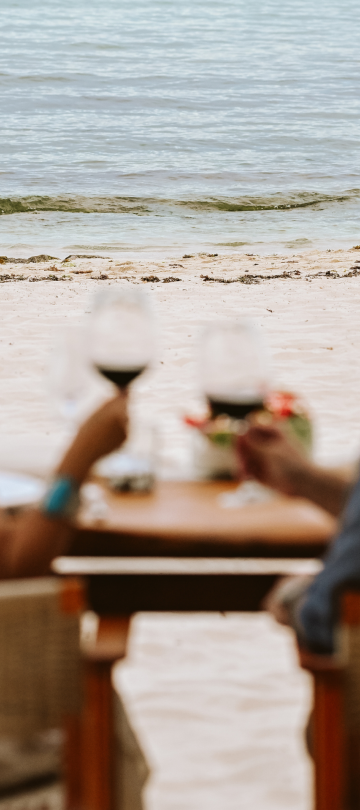 Couple drinking on beach 