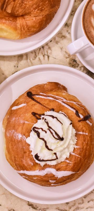 An aerial view of lattes and pastries at BPM at Viceroy Washington DC