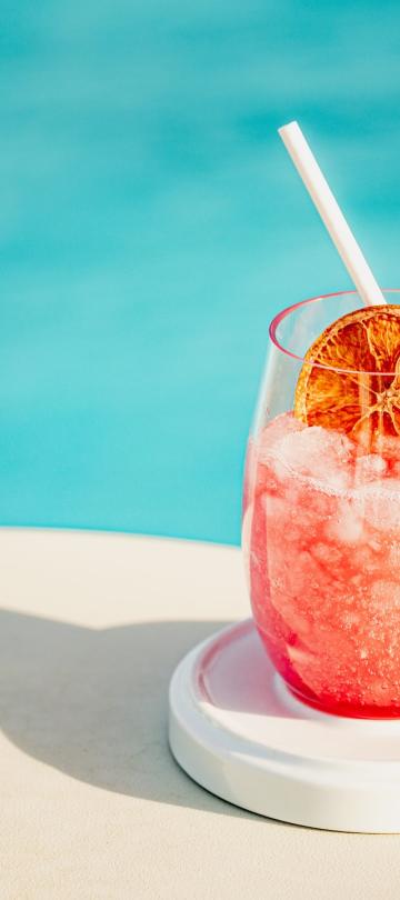 A frozen cocktail on a poolside table, at Hush, the rooftop patio bar at Viceroy Washington DC