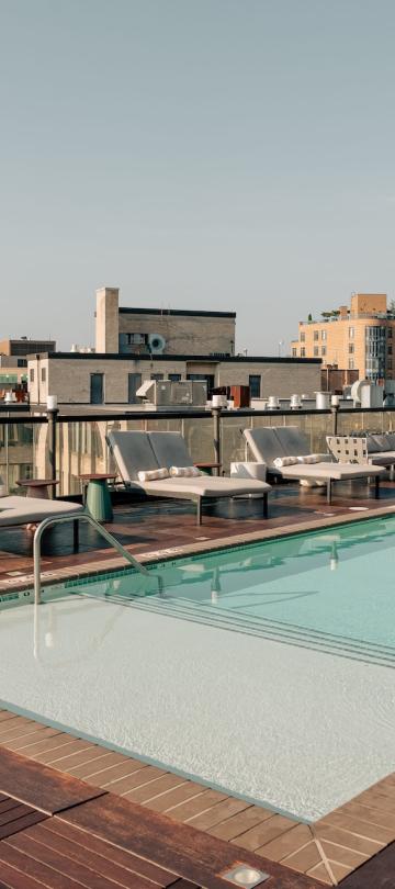 A wide view of the pool deck at Hush, the rooftop patio bar at Viceroy Washington DC