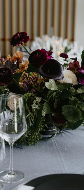 A beautifully decorated wedding guest table with a placement 