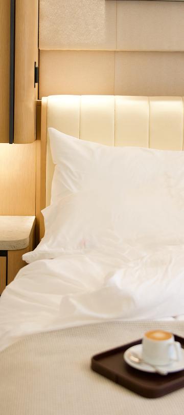Guestroom bed and side,table at The Observatory Sun Valley, A Viceroy Resort