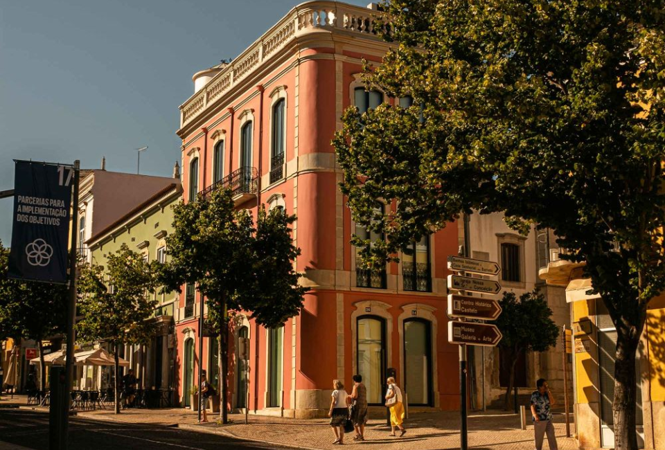 The Loulé market in Algarve, Portugal, a three-story brick building on a charming cobbled street
