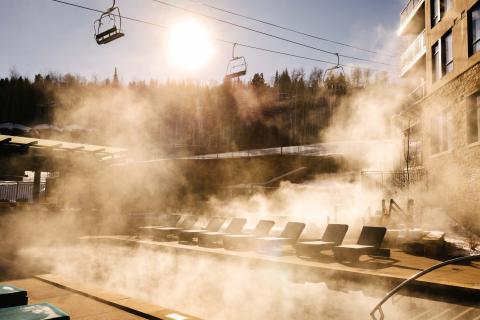 fog over pool with chair lift in the background