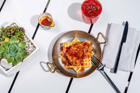 chicken and waffles in a small frying pan