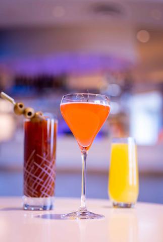 Three cocktails at the bar